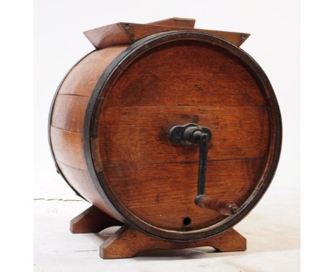 A vintage early 20th century oak butter churn table. With non functional turned handle, barrel form with metal banding. With 