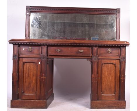 An Arts &amp; Crafts style buffet Charles Beyan style sideboard buffet table. Rectangular from chamfered edge with knee hole 