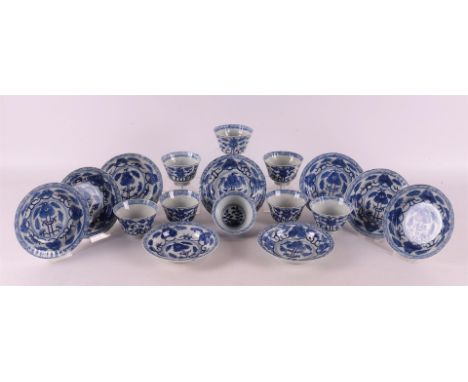 A series of eight blue and white porcelain cups and nine saucers, China, Qing dynasty, 19th century. Blue underglaze decorati