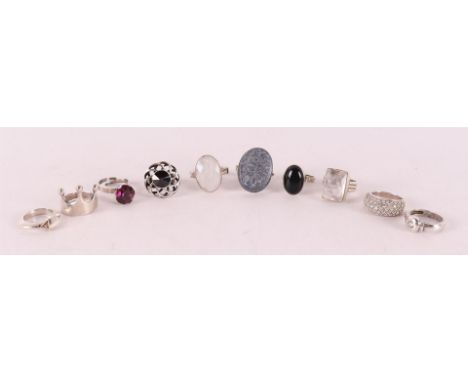 Ten different silver vintage rings set with various stones, up to 10x.