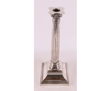 A 3rd grade 800/1000 silver baluster shaped 1-light candlestick, Corinthian column with fluted shaft. Weight 1740 grams gross
