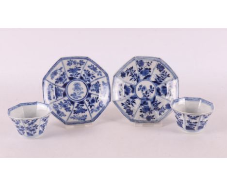 A pair of blue/white porcelain cups and saucers, China, Kangxi, circa 1700. Blue underglaze floral decoration in plane divisi