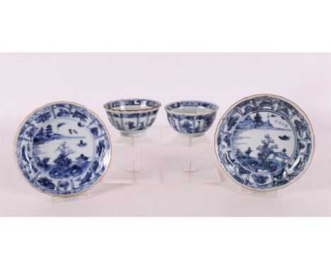 A pair of blue/white porcelain cups and saucers, China, Kangxi circa 1700. Blue/iron red, partly gold-heightened floral decor