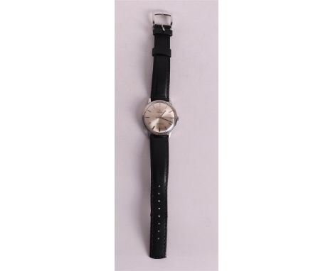 A vintage men's wristwatch Omega Seamaster DeVille on a black leather strap, running movement/not checked.