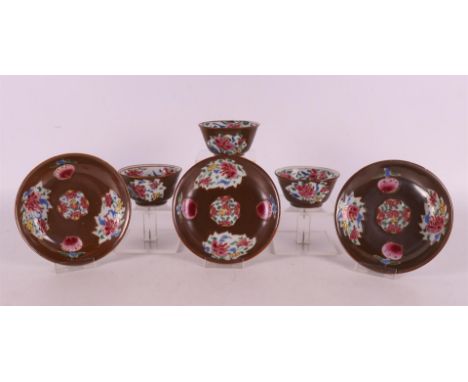 A series of three Batavia famille rose porcelain cups and saucers, China, Qianlong, 18th century. Polychrome decoration of pe