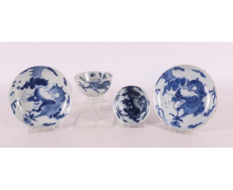 A pair of blue and white porcelain cups and saucers, China, Youngzheng, 18th century. Blue underglaze decoration of dragon wi