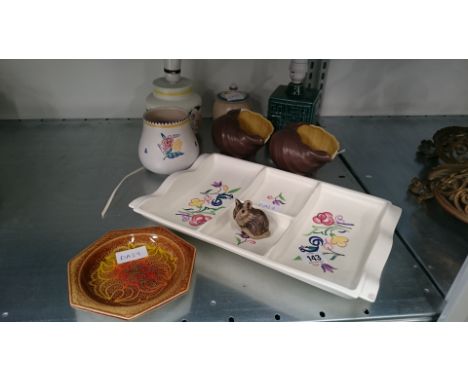 A collection of various Poole Pottery items.