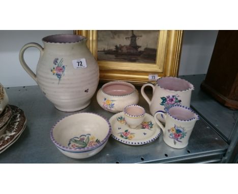 A red bodied Poole Pottery Carter Stabler Adams jug, decorated in the NS pattern by Marion Heath together with five other ear