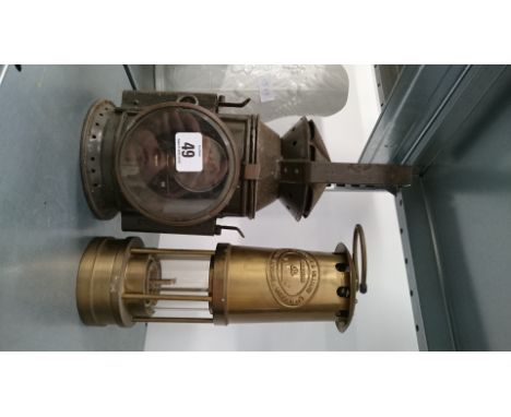 A Thomas & Williams brass miner's lamp together with a painted metal signal lamp.