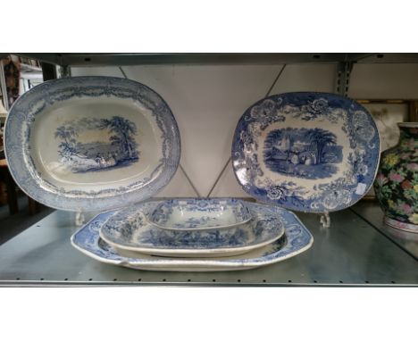 Four various 19th century blue and white china meat plates, decorated with various scenes together with a stone china dish de