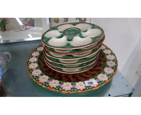 A large Majolica circular dish decorated with white roses and basket weave in the George Jones style (chip to rim) together w