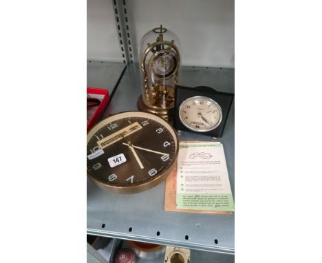 Three various clocks including an Art Deco Hammond Synchronous electric Date and Day alarm clock.