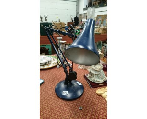 A blue painted angle poise lamp.
