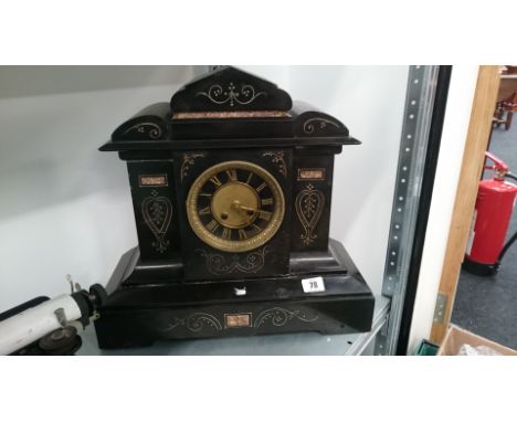 A large late 19th century black slate cased mantle clock.