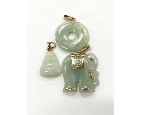A bag containing three 14 carat gold mounted jade pendants.