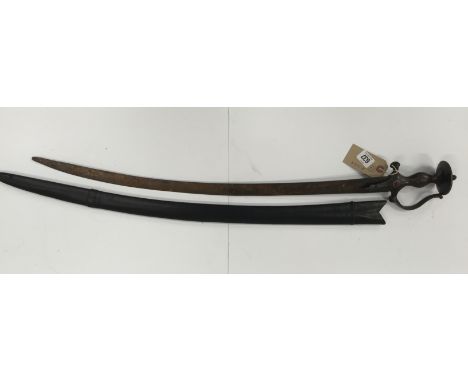 An early 19th century all steel Indian Tulwar with copper bosses on the cross bar with a leather scabbard.
