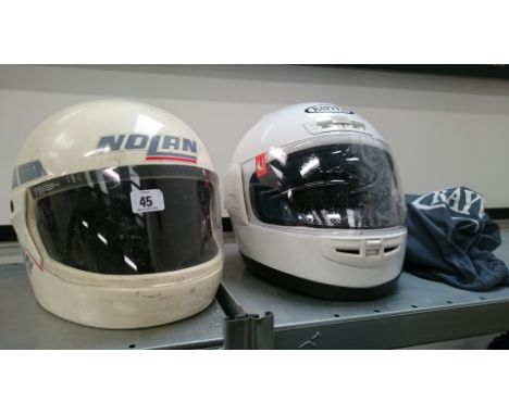 A mid 20th century Rayven white motorcycle helmet (appears unused with original bag) together with a Nolan motorcycle helmet 