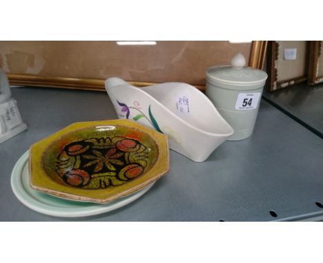 Four various Poole Pottery items.