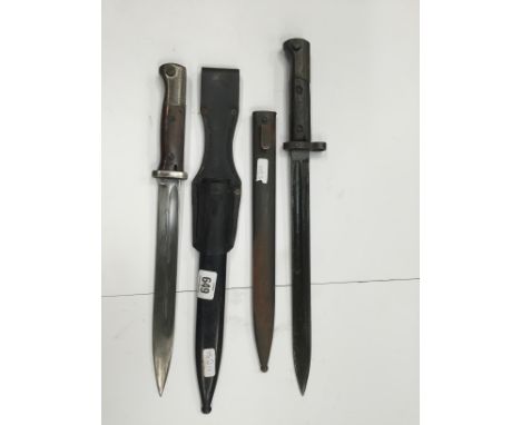 A bayonet for the Mauser K98 with scabbard and frog, early wooden grips, non matching numbers together with a Czechoslovakian
