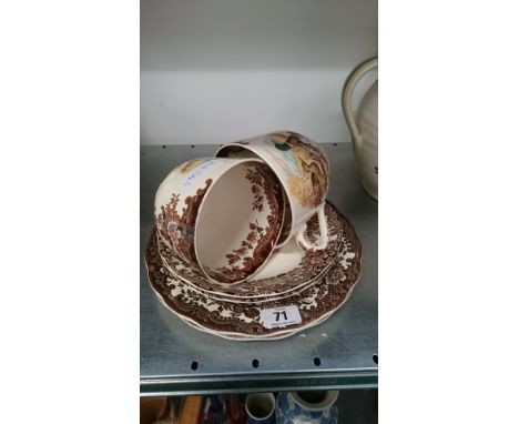 A pair of Royal Worcester Palissy Game Series breakfast cups, saucers and plates.