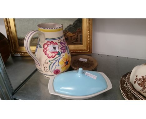 A Poole Pottery jug decorated in the CS pattern together with a butter dish and two Barbara Linley Adams saucer dishes.