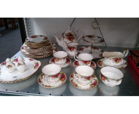 The residue of a Royal Albert Old Country Roses dinner and tea service.