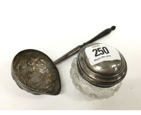 A silver metal Toddy ladle together with a silver lidded cut glass dressing table pot.