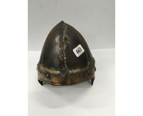 An Indo Persian helmet, the top half made from an early European helmet, a brass base below with holes for chain mail.