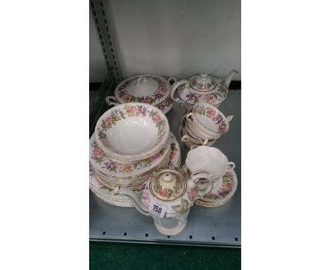The residue of a Paragon china dinner and tea service decorated in the Country Lane pattern.