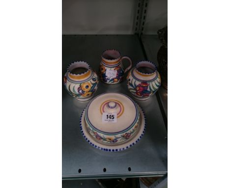 Four various Poole Pottery items.