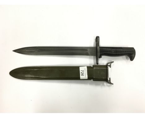 An M1 Garrand bayonet and scabbard, Bakelite handle and olive green scabbard.