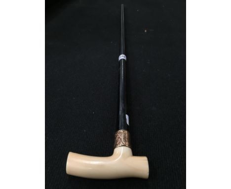 A late 19th century ivory handled walking stick with 15 carat gold mount.