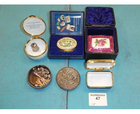 Four enamel patch boxes and a white metal example