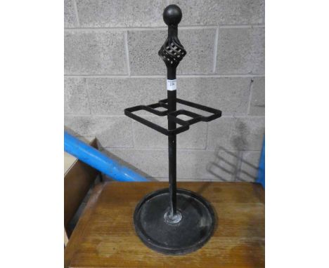 A wrought iron stick/umbrella stand