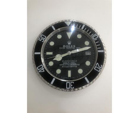 Rolex-style wall clock, Submariner design.Attractive wall clock in the style of a Rolex Submariner in Black and Stainless. Lu