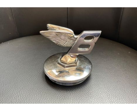 A novelty item, not manufactured by Bentley, but fun all the same.Chromed with screw fixing on base. Measuring 9cm base diame