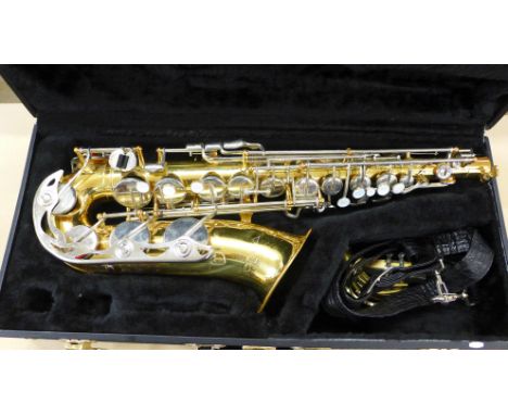 A cased Vito saxophone 