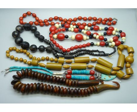 A collection of vintage bead necklaces including horn 