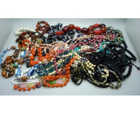 A collection of vintage and modern bead necklaces 