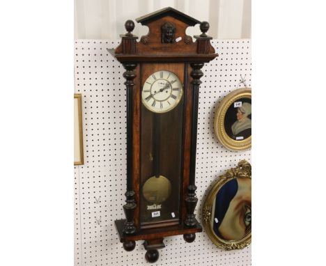 Victorian Walnut Cased 8 day Regulator Wall Clock, the white enamel face with Roman numerals and seconds dial, 122cm high 