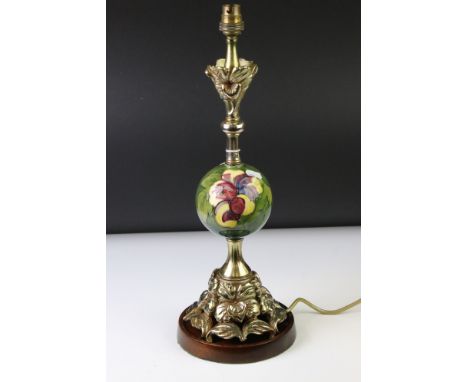 Moorcroft Hibiscus pattern ceramic and brass table lamp with spherical ceramic mid-section, and a cast brass floral base and 