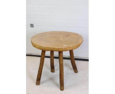 Rustic Polished Elm Circular Table, the top made from a single slice of trunk, raised on four turned legs, possibly Maxie Lan