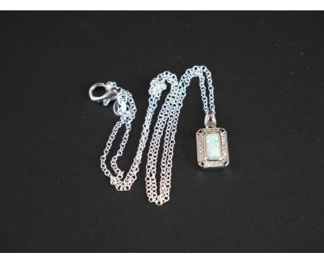 Silver pendant necklace, set with opal panel surrounded by CZs 