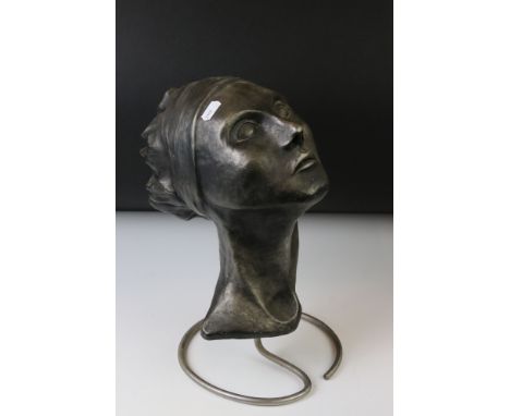 Averil Leah - Ceramic sculpture of a lady's head, the lady with headband and flowing hair, mounted on an aluminium stand, app