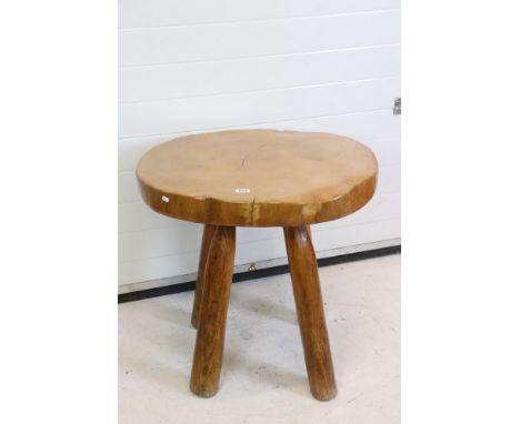 Rustic Polished Elm Circular Table, the top made from a single slice of trunk, raised on four turned legs, possibly Maxie Lan
