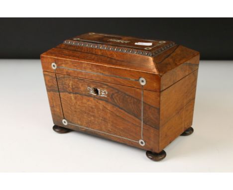 Early 19th century rosewood sarcophagus tea caddy, mother of pear inlaid decoration, the hinged lid opening to reveal two lid