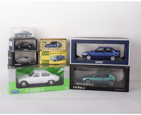 A collection of seven Peugeot model cars in varying scales. To include a 1:18 scale Nex Models Peugeot 504, a 1:18 scale Nore