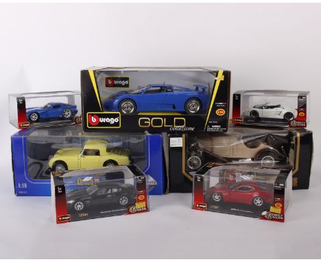 Six boxed Burago 1:18 and 1:32 scale model cars along with a Revell Austin-Healey Sprite. Burago: 1:18 scale Mercedes Benz SS