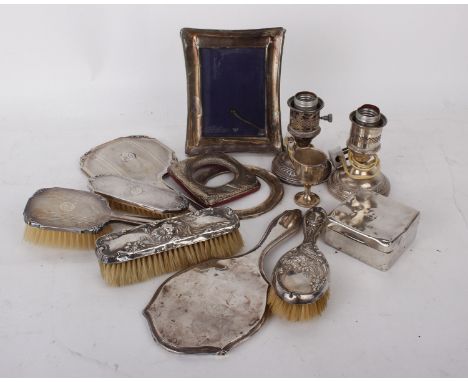 A collection of early 20th century Sterling silver dressing sets to include hand mirrors, brushes &amp; picture frames togeth