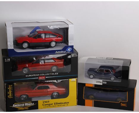 A collection of five boxed model cars of varying scale, brand and model manufacturer. To include a 1:18 scale Die-Cast Sun St